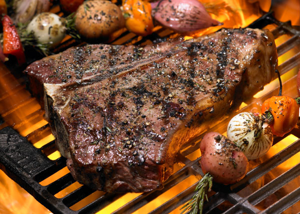 grilling-Steak Grilling Steak on open flame