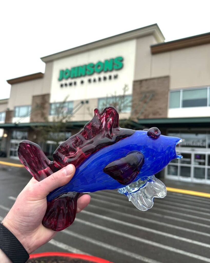 Ruby the Fish up against the Johnsons Home & Garden Storefront in the background.